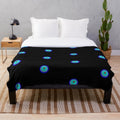 Fluorescent plush blanket with abstract geometric design and colorful patterns