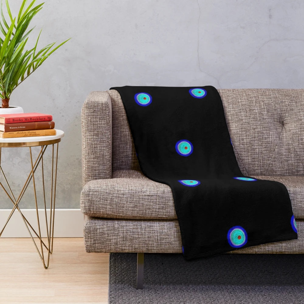 Fluorescent plush blanket with abstract geometric design and colorful patterns