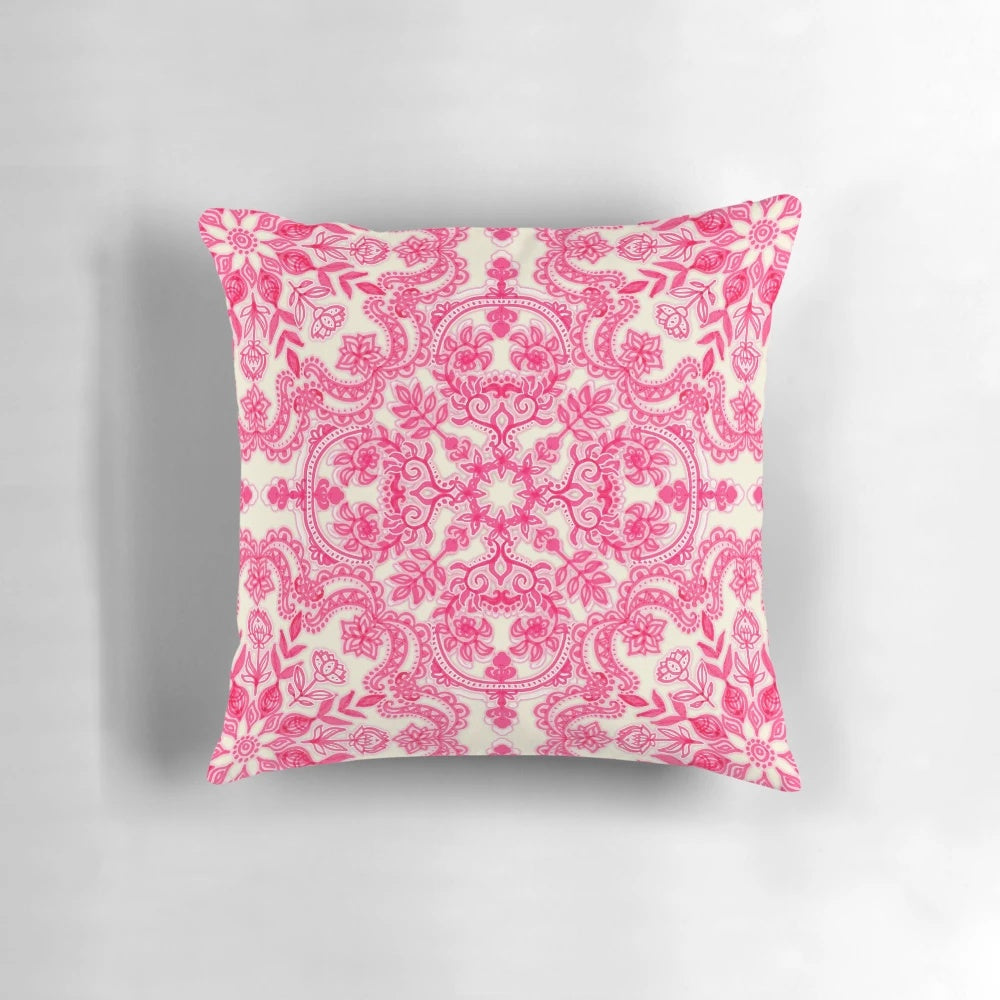Vibrant hot pink and soft cream decorative pillow with a folk art inspired pattern