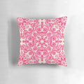 Vibrant hot pink and soft cream decorative pillow with a folk art inspired pattern