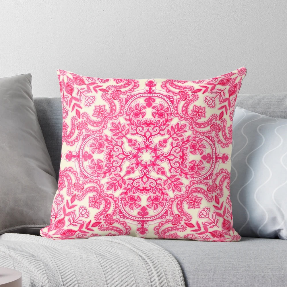 Vibrant hot pink and soft cream decorative pillow with a folk art inspired pattern