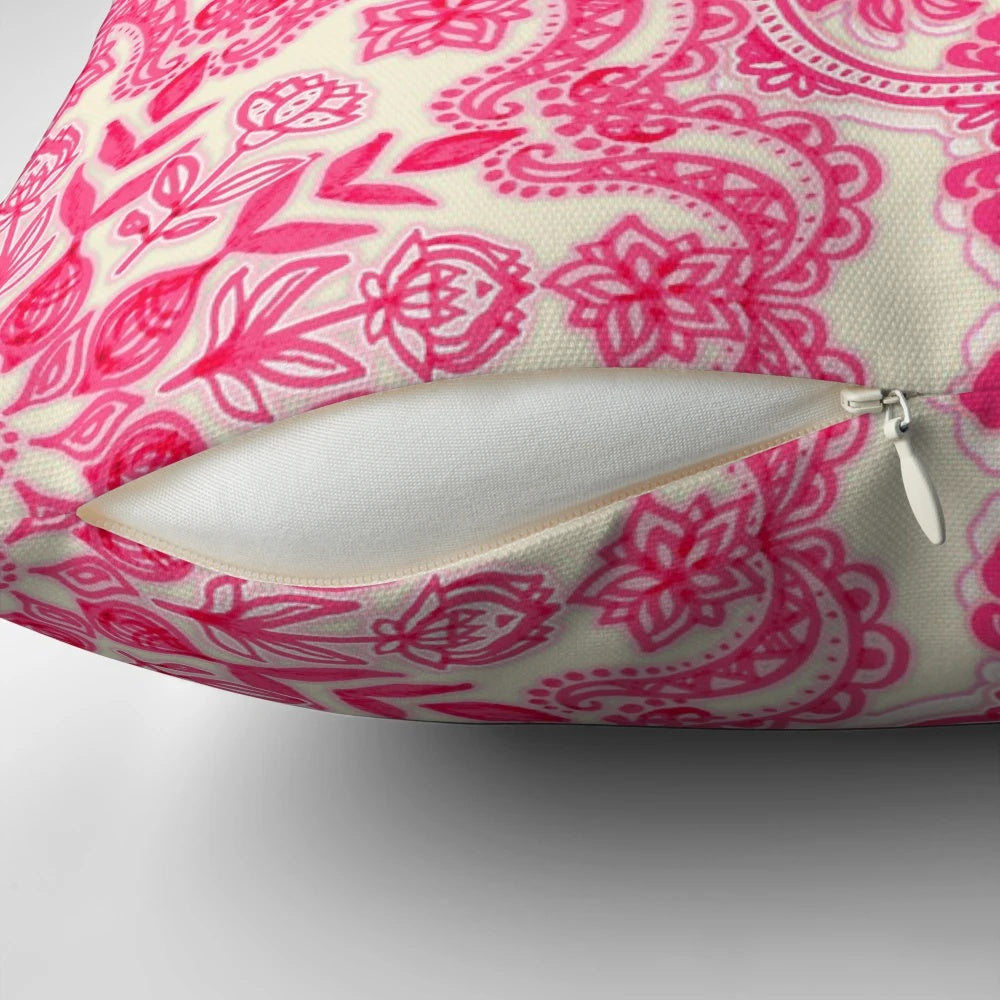 Vibrant hot pink and soft cream decorative pillow with a folk art inspired pattern