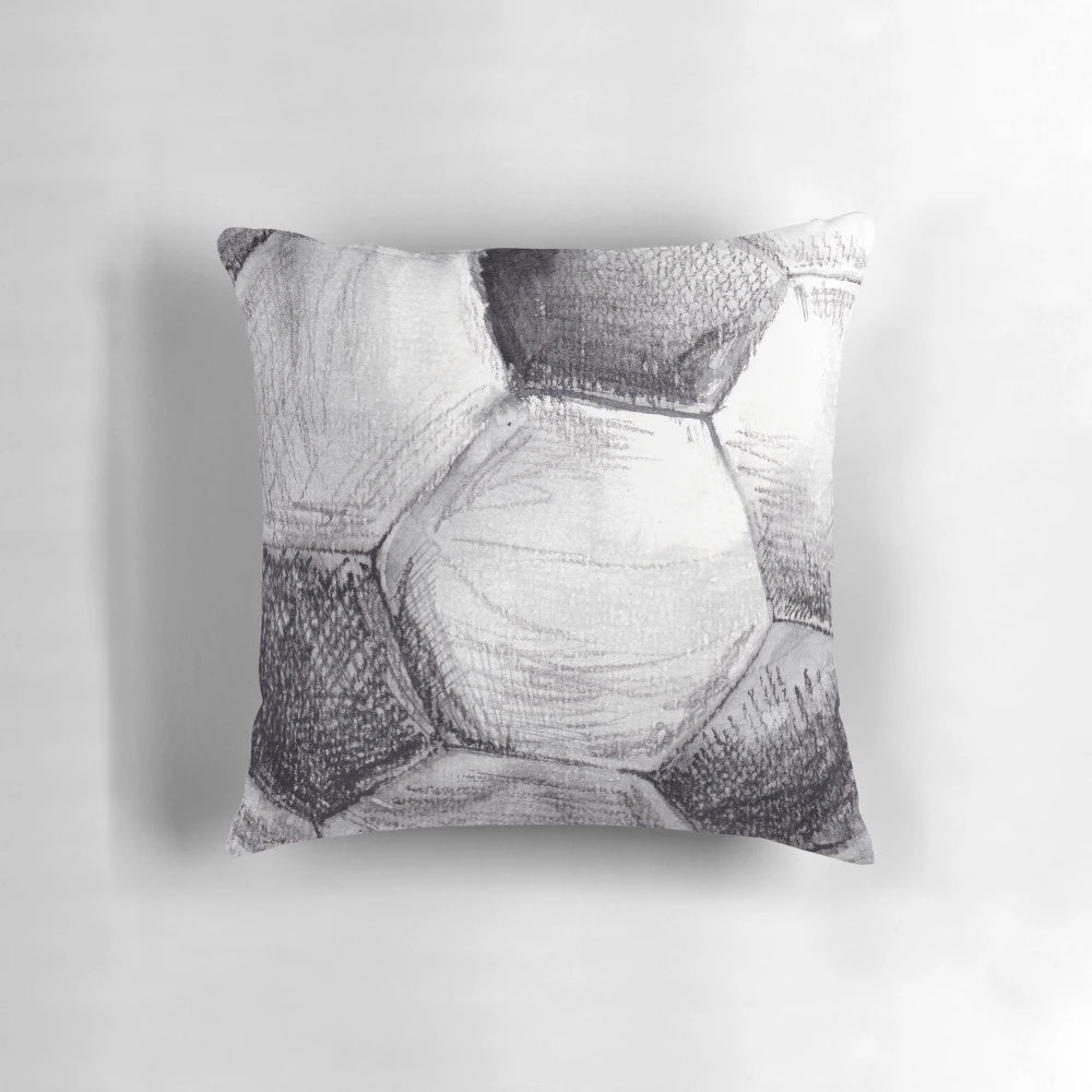 Vibrant watercolor illustration of a football/soccer ball on a plush pillow