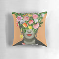 Colorful and artsy Frida Floral decorative pillow featuring a floral collage design in shades of orange.