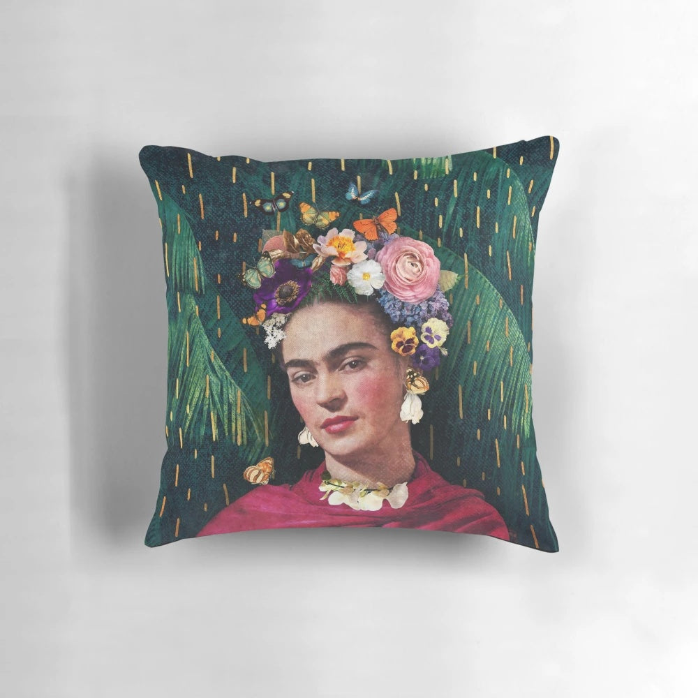 Colorful decorative pillow featuring a collage-style image of Frida Kahlo surrounded by tropical flowers and foliage.