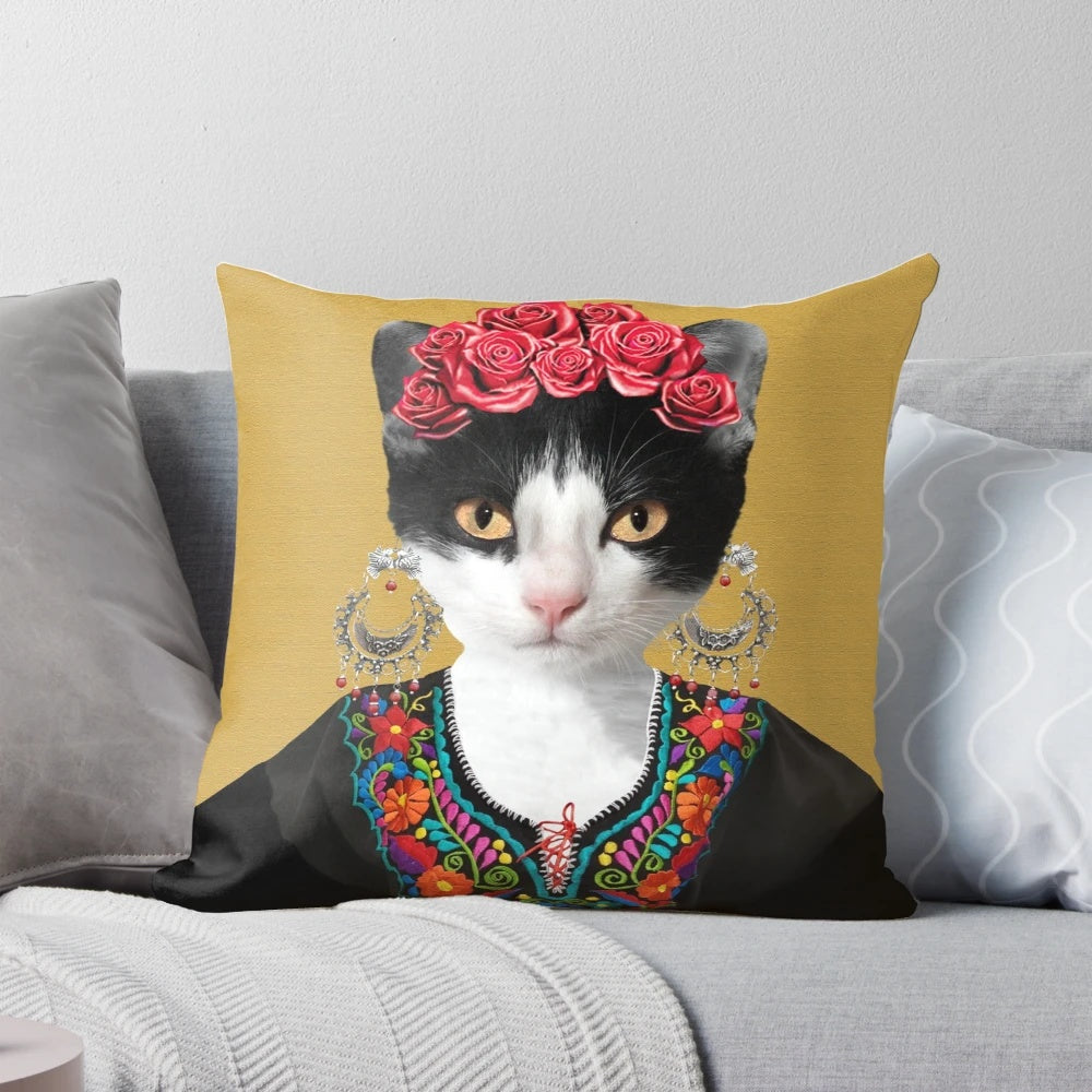 Colorful floral pillow featuring a portrait of Frida Kahlo with a black cat, highlighting the artist's feminist and feline-inspired artwork.