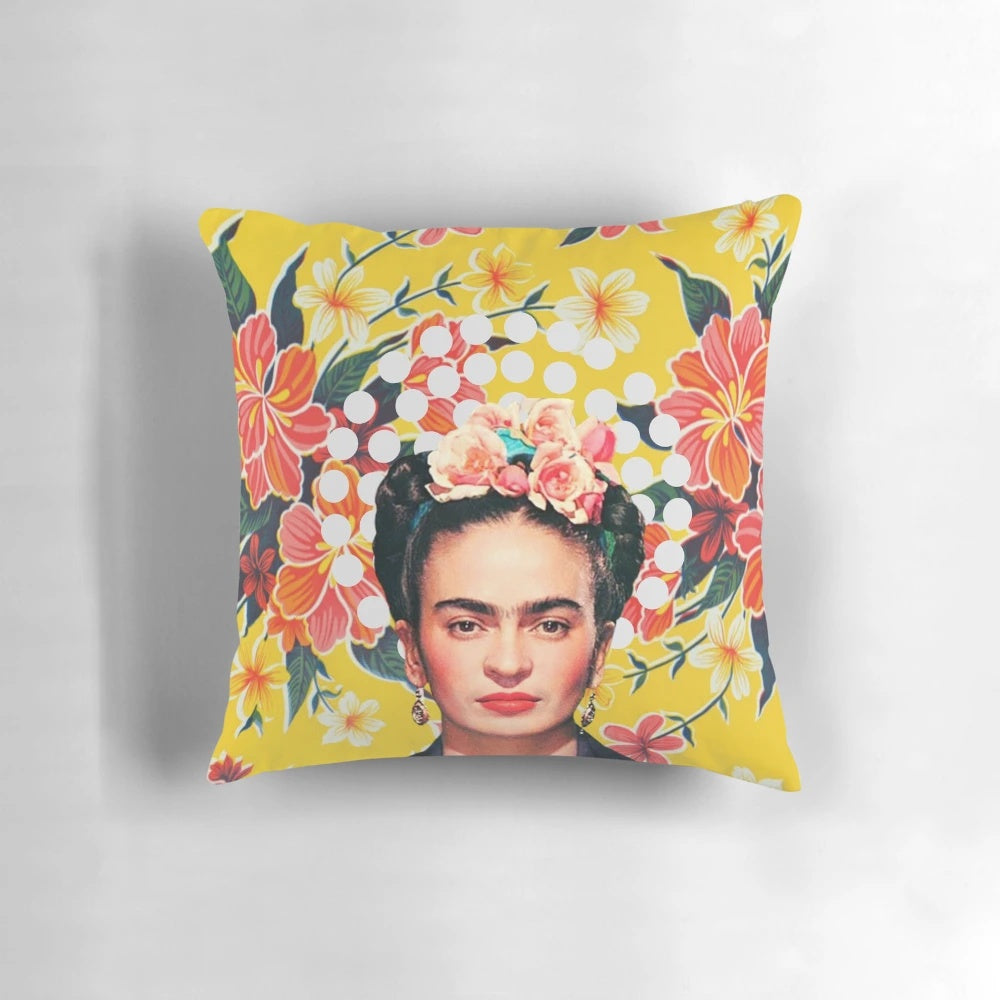 Colorful abstract floral pillow featuring Frida Kahlo-inspired design on ocher Mexican tablecloth background