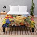 Colorful floral plush blanket featuring Frida Kahlo inspired imagery