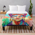 Colorful plush blanket featuring Frida Kahlo's iconic art