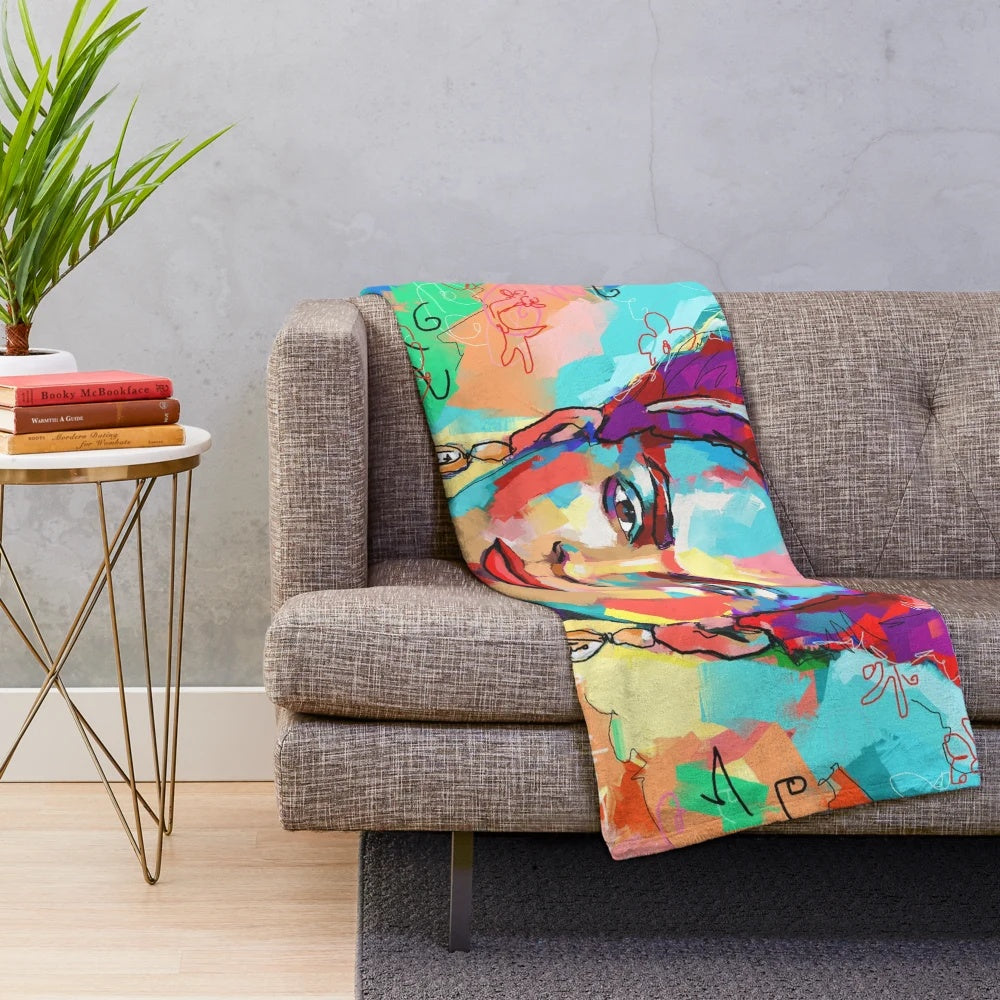 Colorful plush blanket featuring Frida Kahlo's iconic art