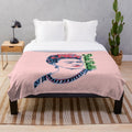 Colorful plush blanket featuring the iconic image of artist Frida Kahlo