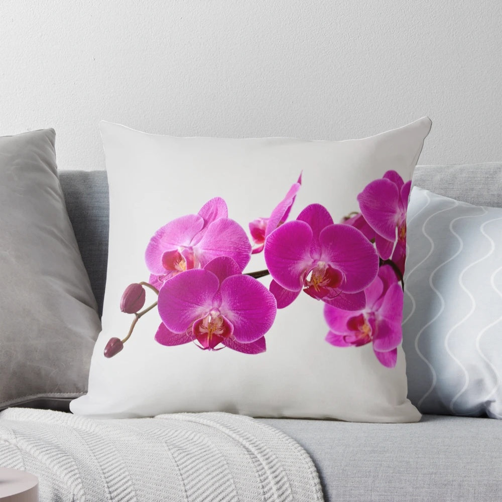 Closeup of a fuchsia magenta floral pillow with vibrant petals and blooms