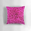 Closeup image of a fuchsia pink flower decorative pillow