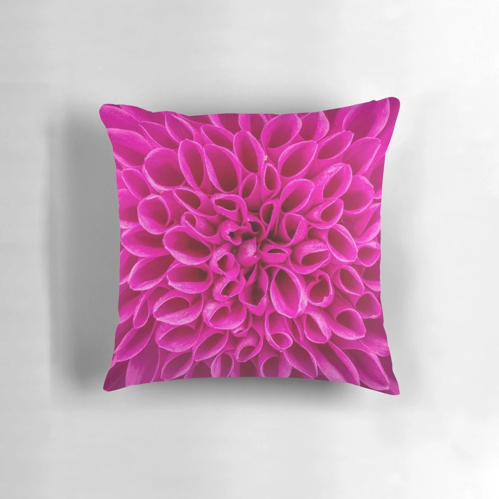 Closeup image of a fuchsia pink flower decorative pillow
