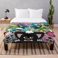 Colorful furby plush throw blanket with 90s pop art design