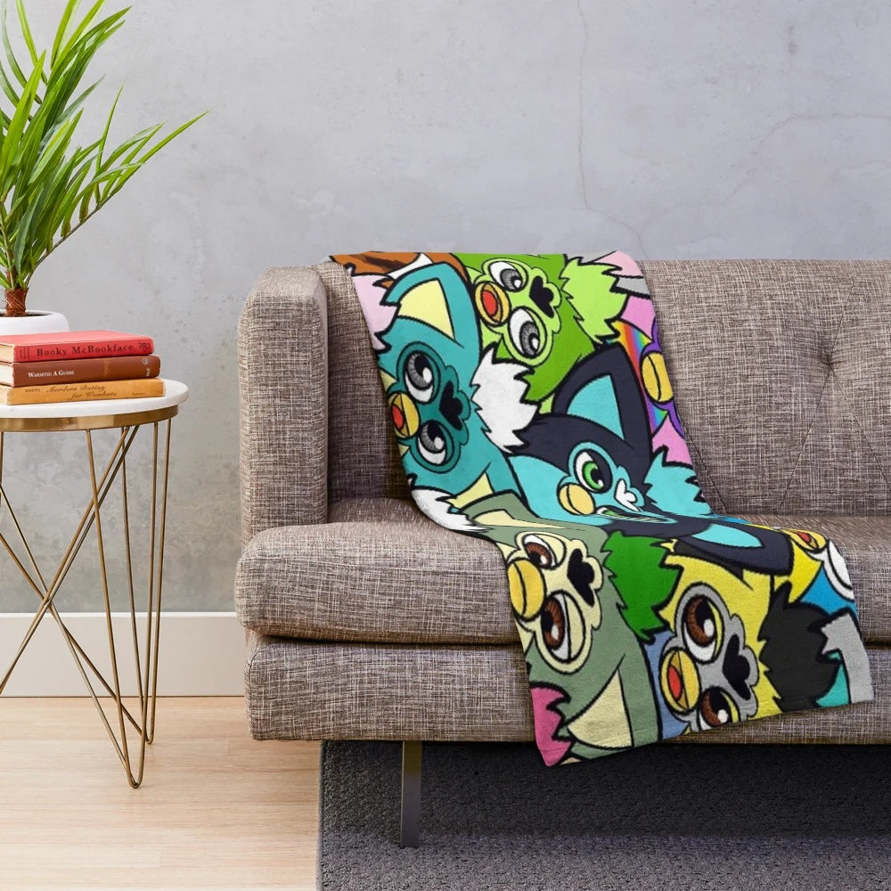 Colorful furby plush throw blanket with 90s pop art design