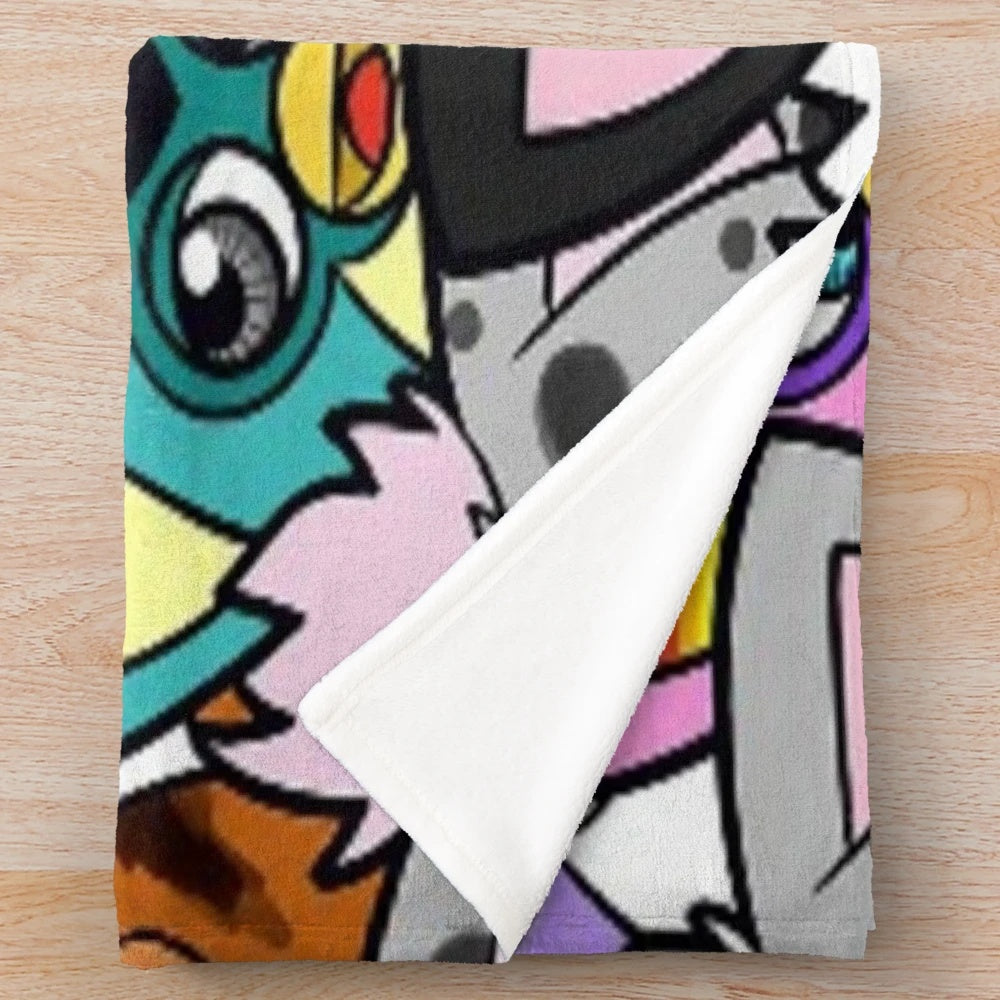 Colorful furby plush throw blanket with 90s pop art design