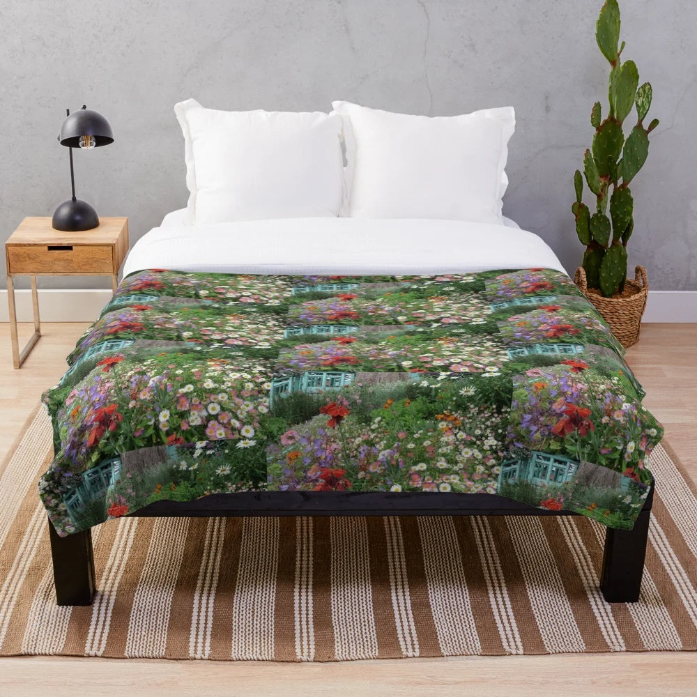 Colorful plush blanket featuring a garden scene with flowers