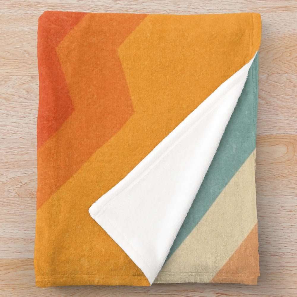 Plush blanket with vibrant geometric abstract pattern