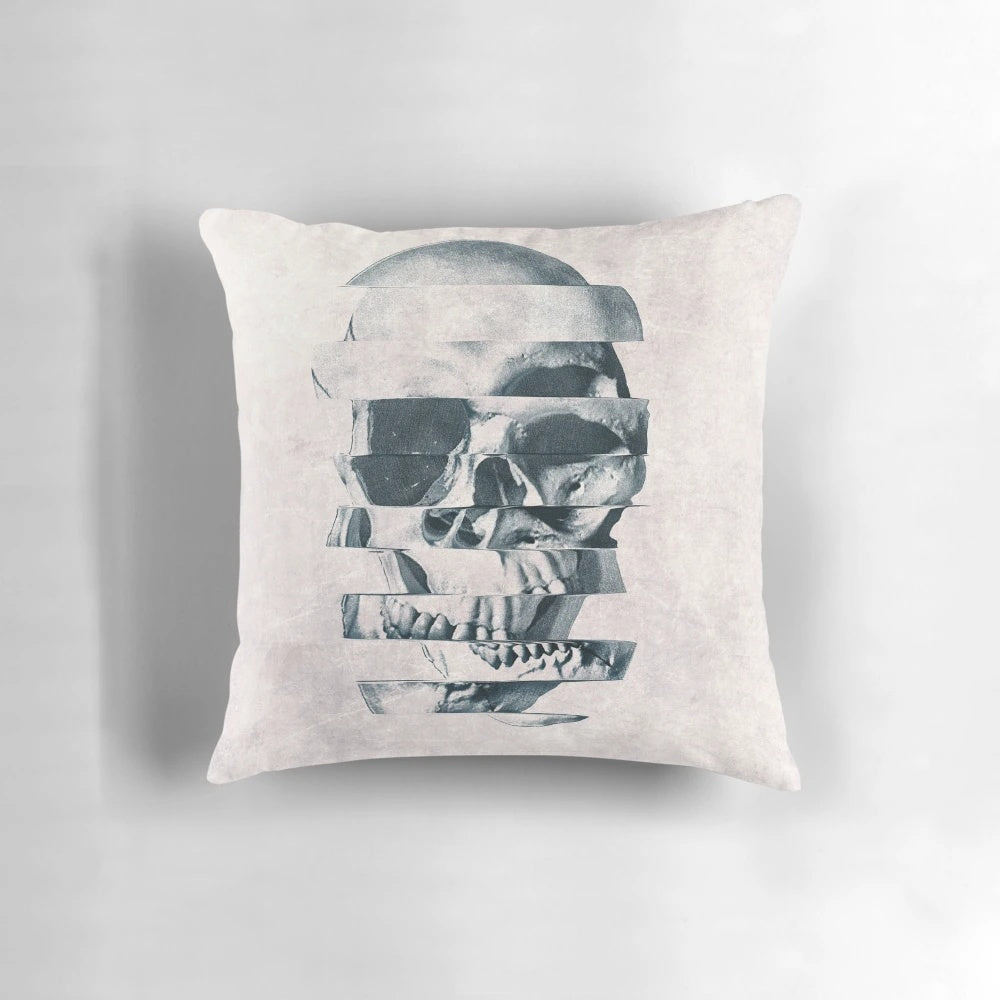 Monochromatic graphic skull print on a cozy throw pillow with a bold, geometric pattern design.