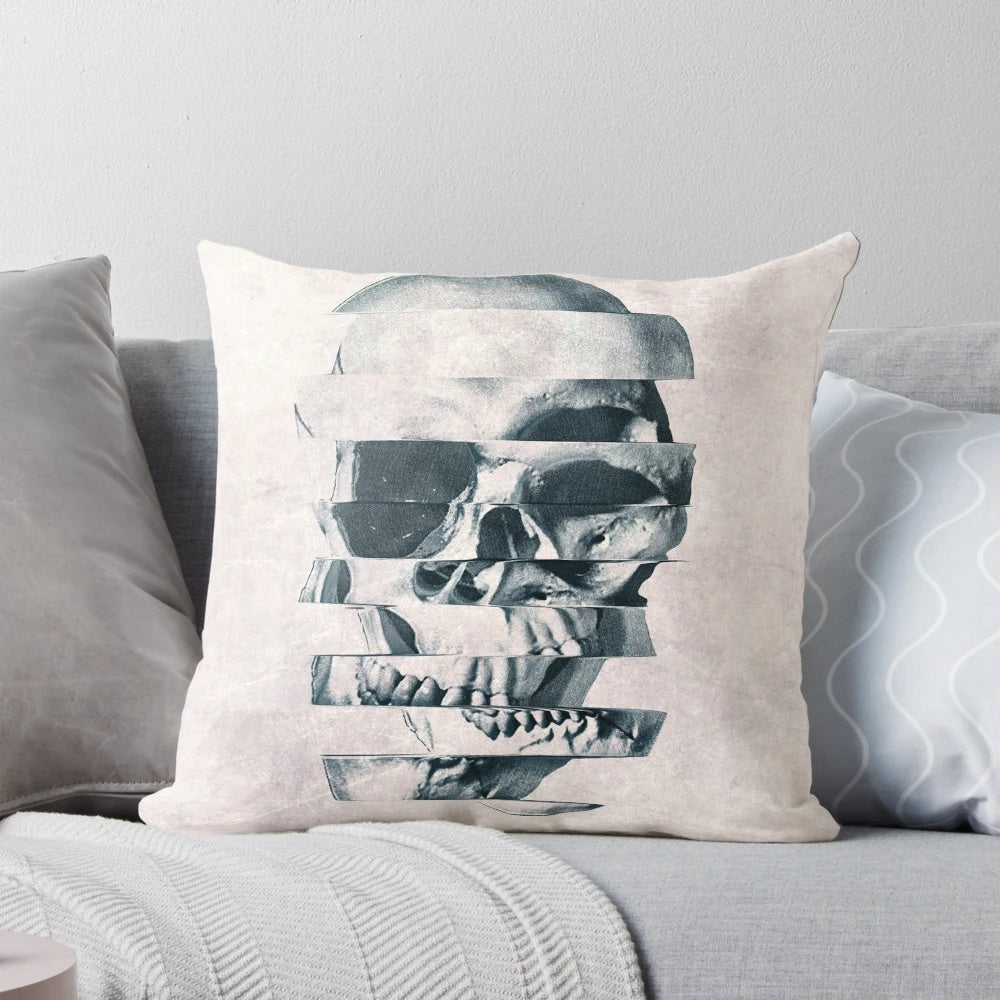 Monochromatic graphic skull print on a cozy throw pillow with a bold, geometric pattern design.