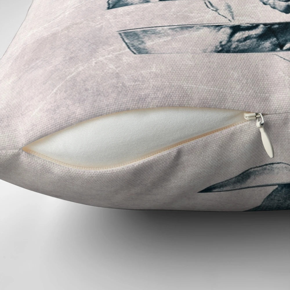 Monochromatic graphic skull print on a cozy throw pillow with a bold, geometric pattern design.
