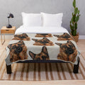 Colorful German Shepherd dog on a cozy autumn-themed plush blanket