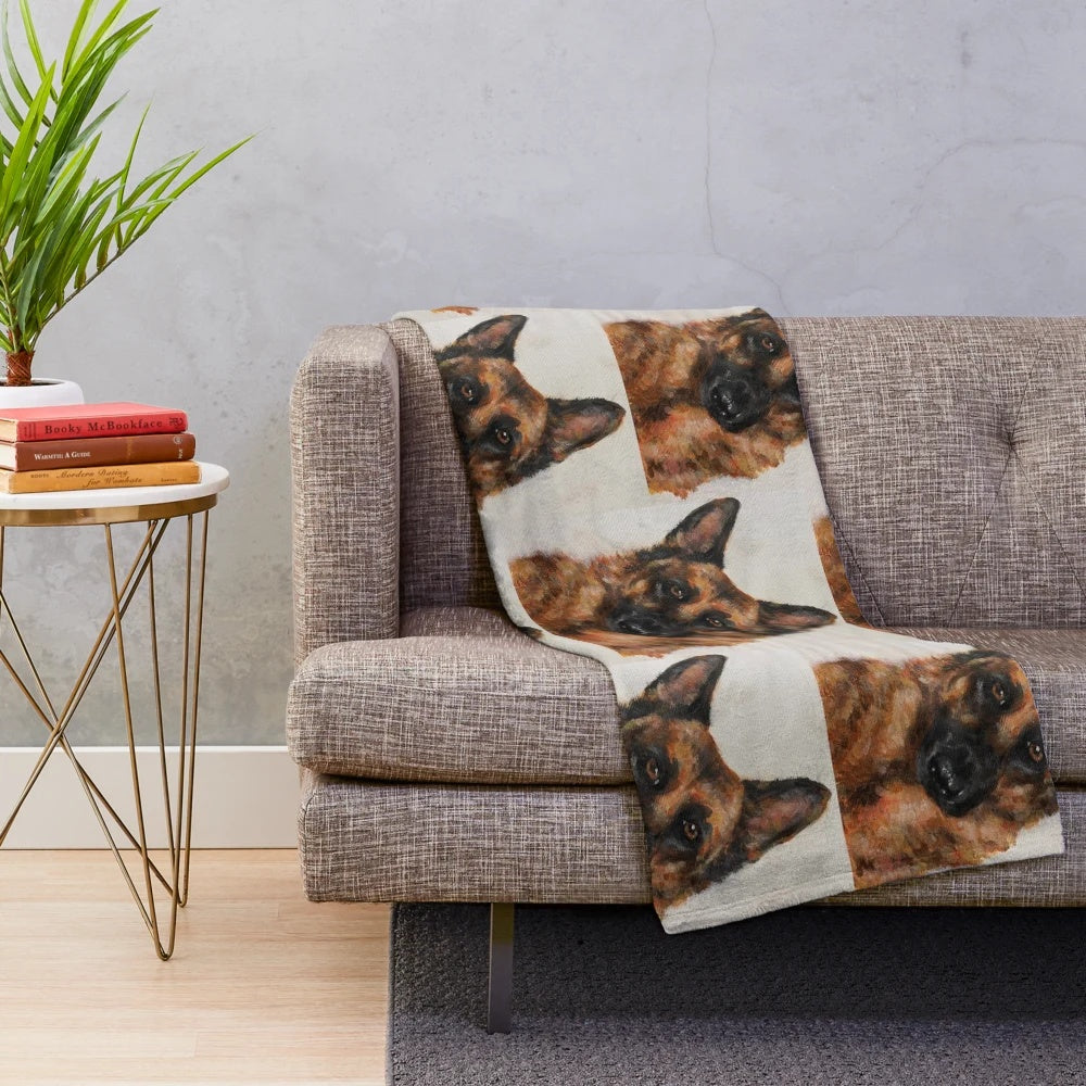 Colorful German Shepherd dog on a cozy autumn-themed plush blanket