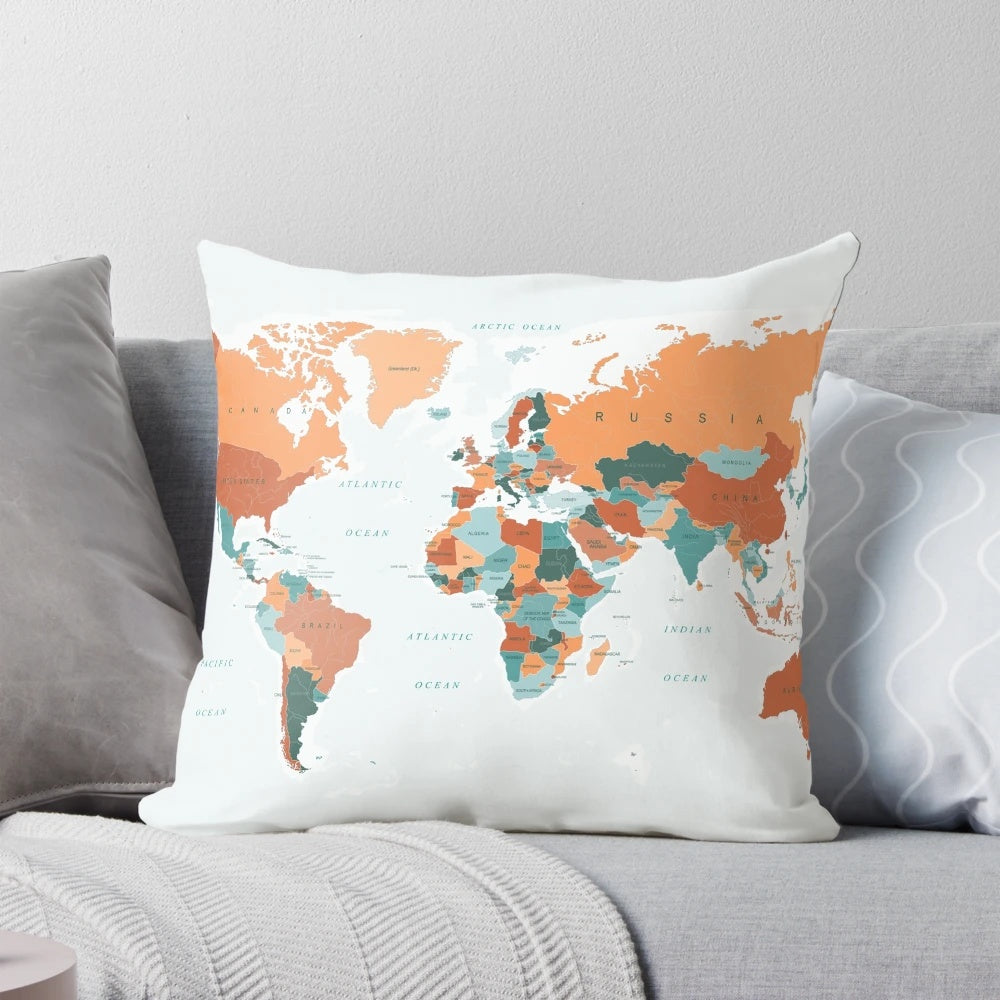 Decorative pillow featuring a vibrant world map design in burnt orange and teal colors