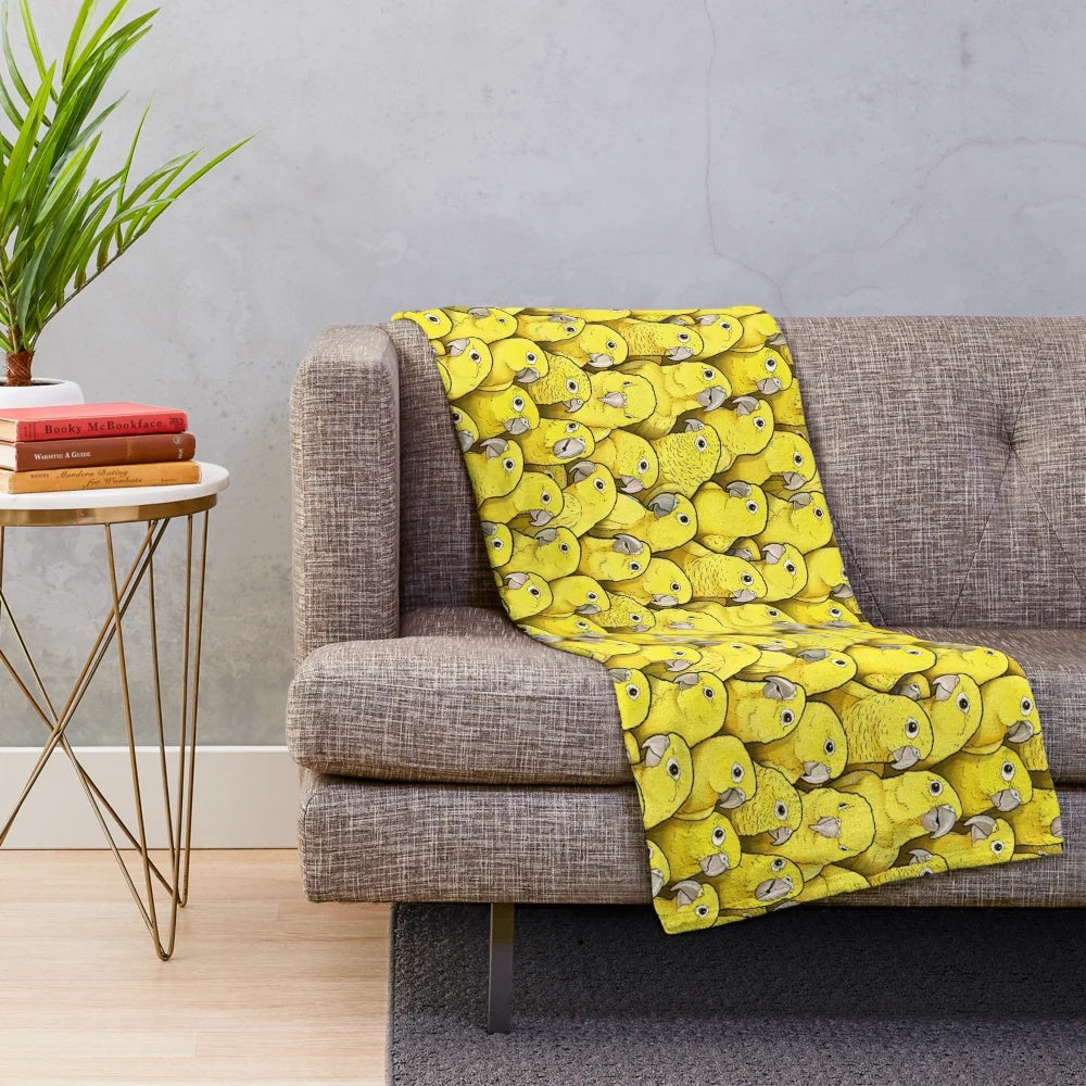 Soft and cuddly plush blanket with a vibrant golden conure parrot design