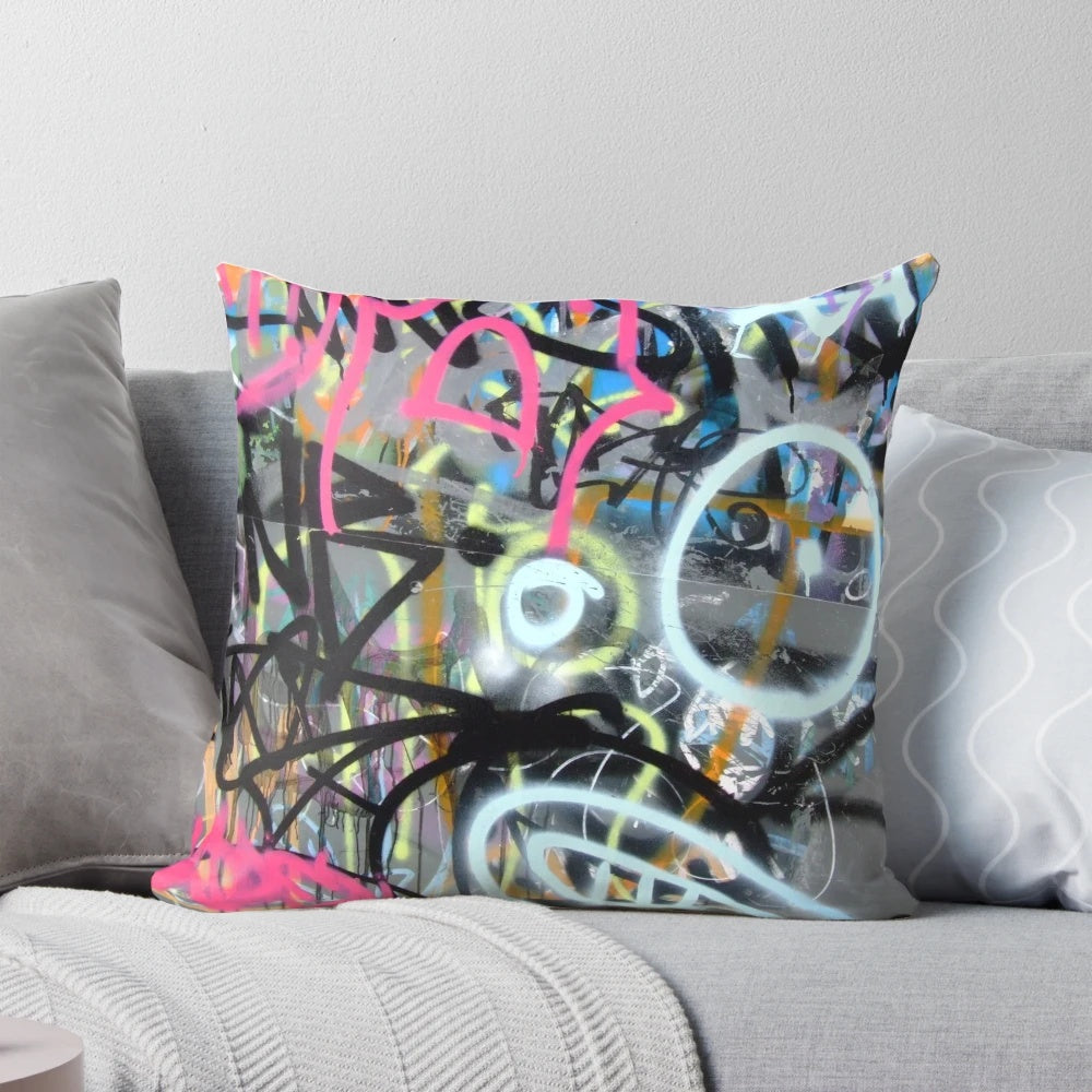 Colorful graffiti-patterned throw pillow for modern, urban-inspired home decor