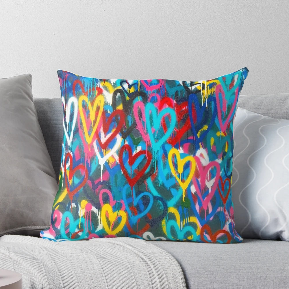 Colorful graffiti-style painting on a throw pillow with a grungy, urban aesthetic.