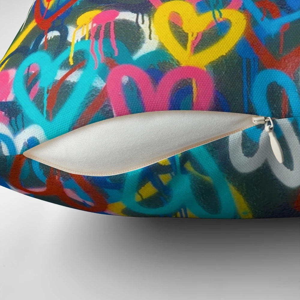 Colorful graffiti-style painting on a throw pillow with a grungy, urban aesthetic.