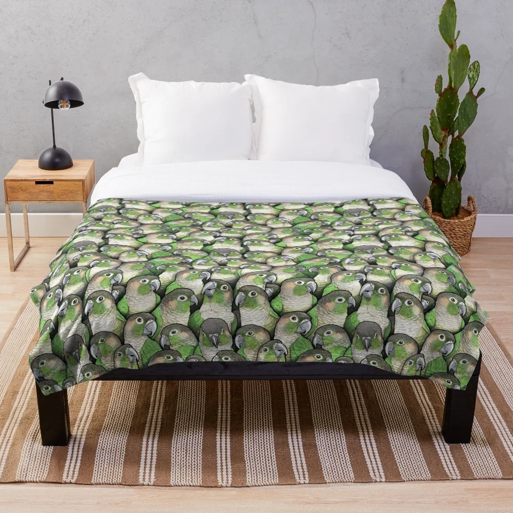 Green cheeked conure inspired plush blanket featuring a colorful bird pattern design