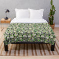 Green cheeked conure inspired plush blanket featuring a colorful bird pattern design