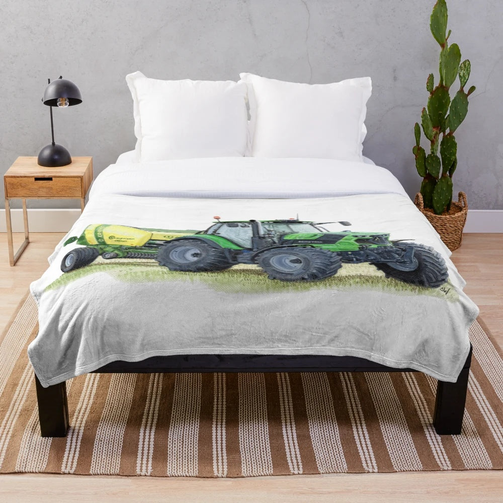 Tractor plush blanket featuring a vivid green tractor painting