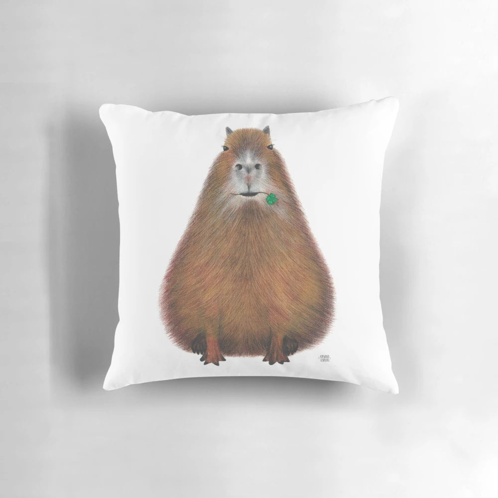 Colorful hand-illustrated capybara design on a plush, high-quality accent pillow.