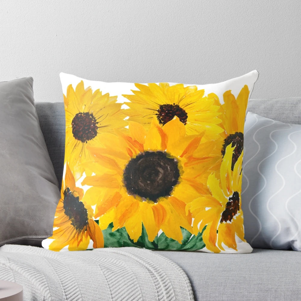 Colorful handmade throw pillow featuring a painted sunflower bouquet design in shades of yellow and green.