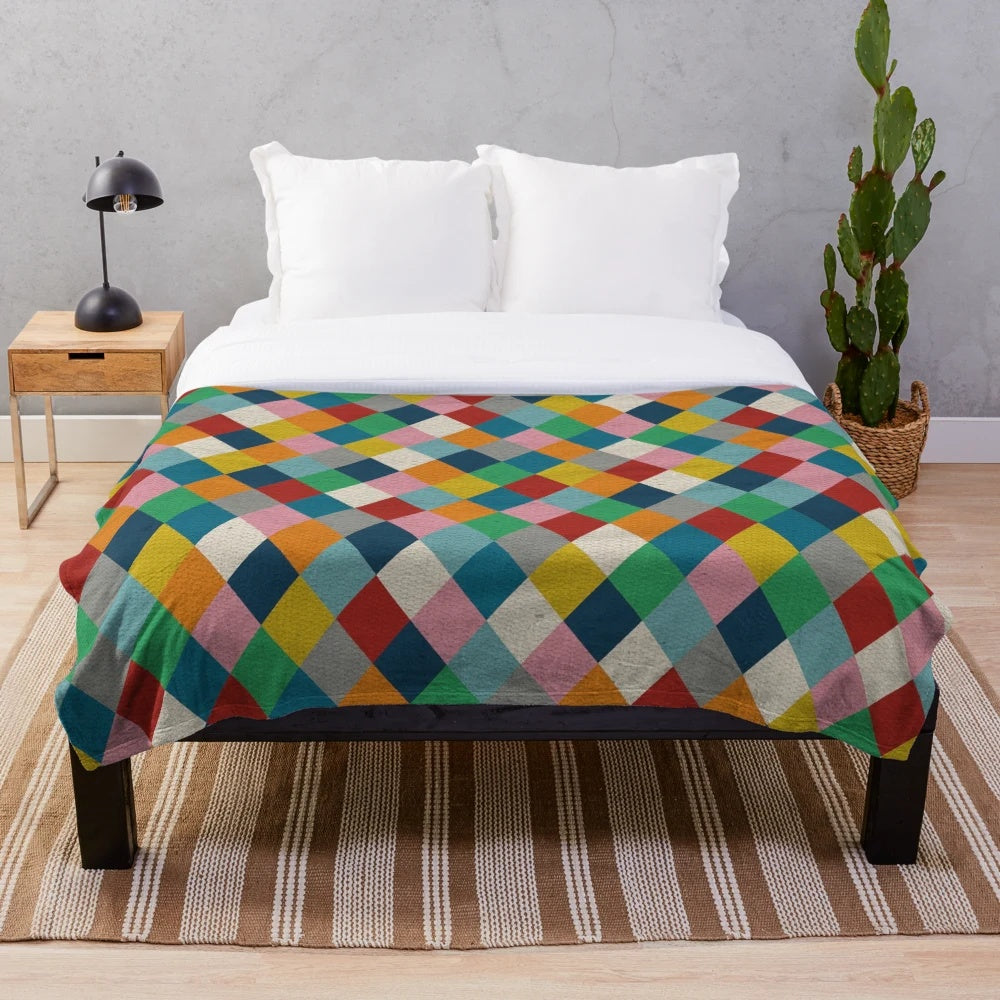 Colorful harlequin pattern plush blanket