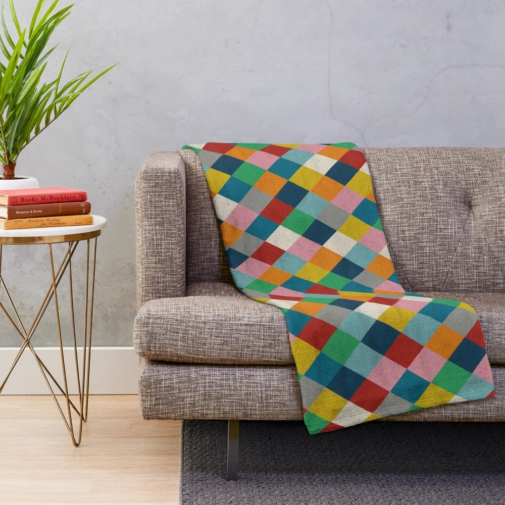 Colorful harlequin pattern plush blanket