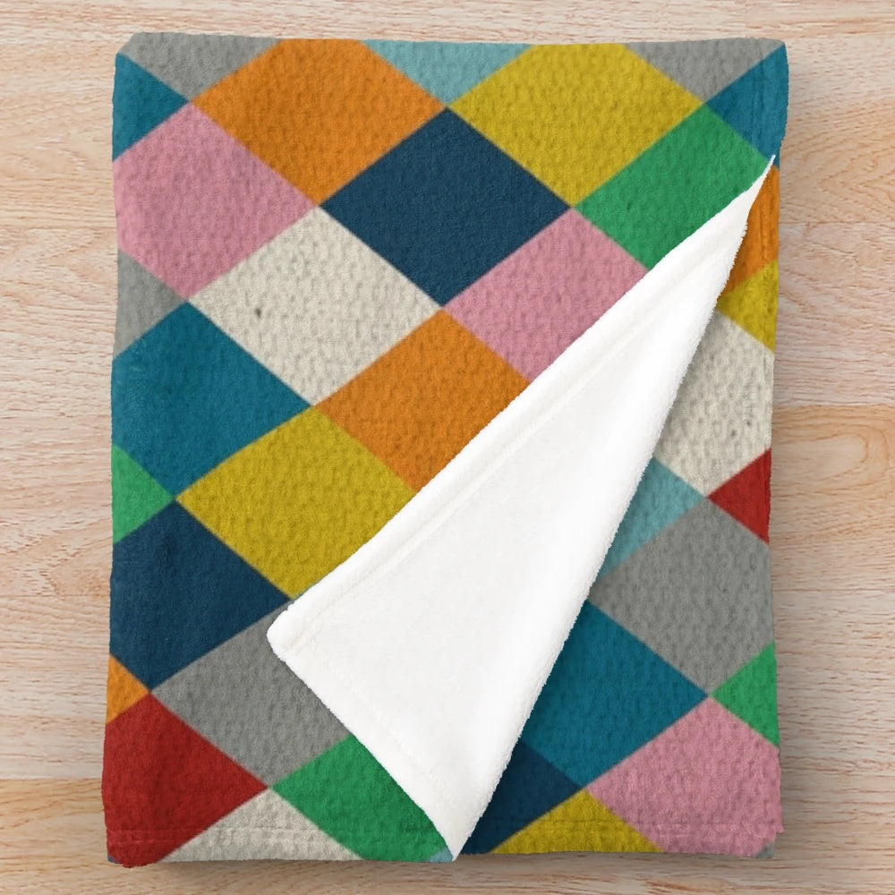 Colorful harlequin pattern plush blanket