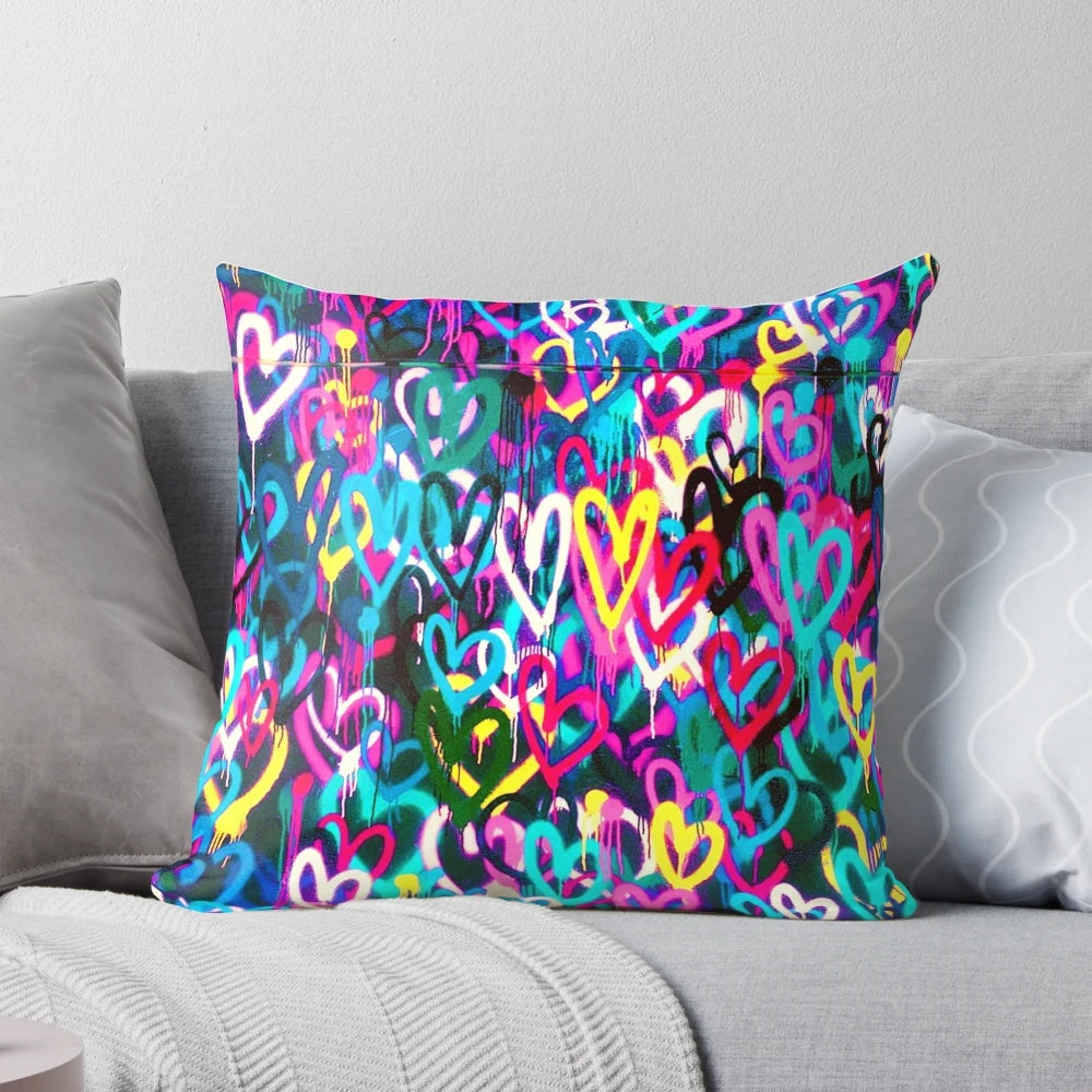 Colorful heart-themed decorative pillow featuring urban street art-inspired design