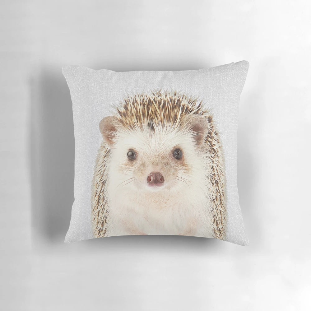 Colorful and whimsical hedgehog design on a decorative throw pillow, perfect for a modern nursery or child's room.
