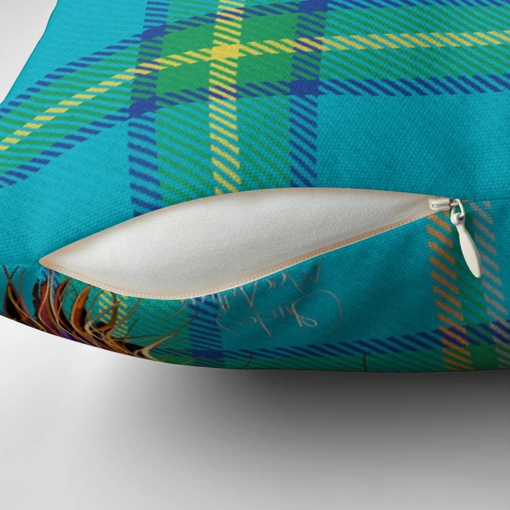 Colorful and cozy decorative pillow featuring a friendly highland cow against a tartan pattern background.