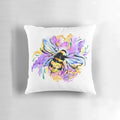 A Pillow featuring a detailed illustration of a honeybee surrounded by lavender and abstract floral patterns in shades of pink and purple.