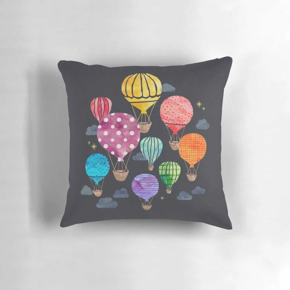 Cozy decorative pillow featuring a hand-painted hot air balloon design against a night sky backdrop.