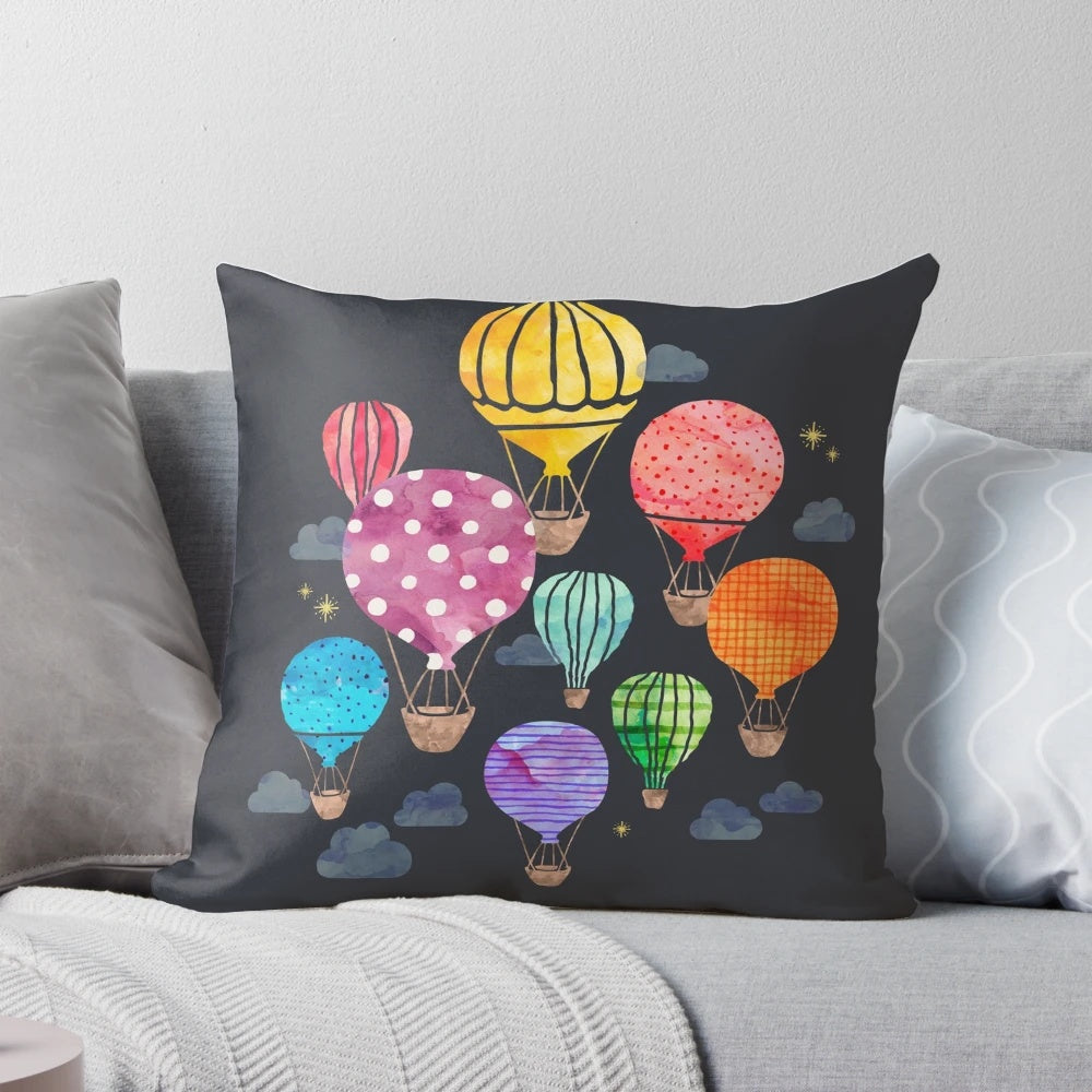 Cozy decorative pillow featuring a hand-painted hot air balloon design against a night sky backdrop.