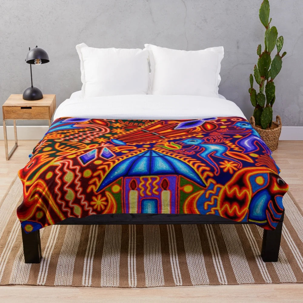 Colorful plush blanket with traditional Huichol textile design
