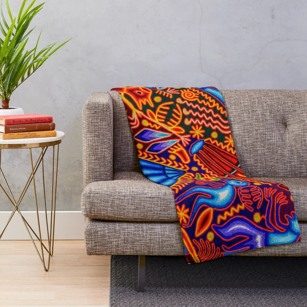 Colorful plush blanket with traditional Huichol textile design