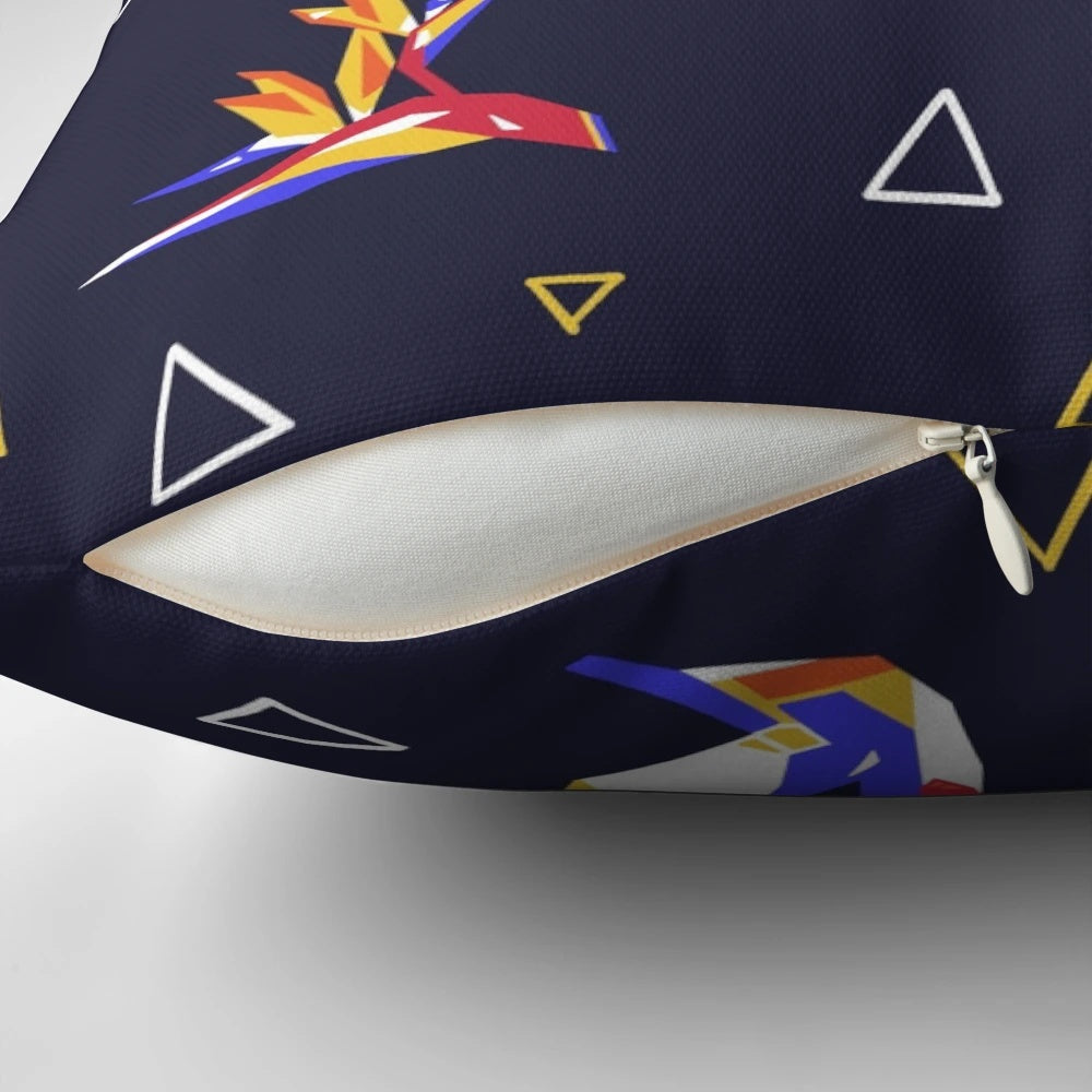 Colorful pillow featuring a geometric, floral design with hummingbirds in a tropical paradise